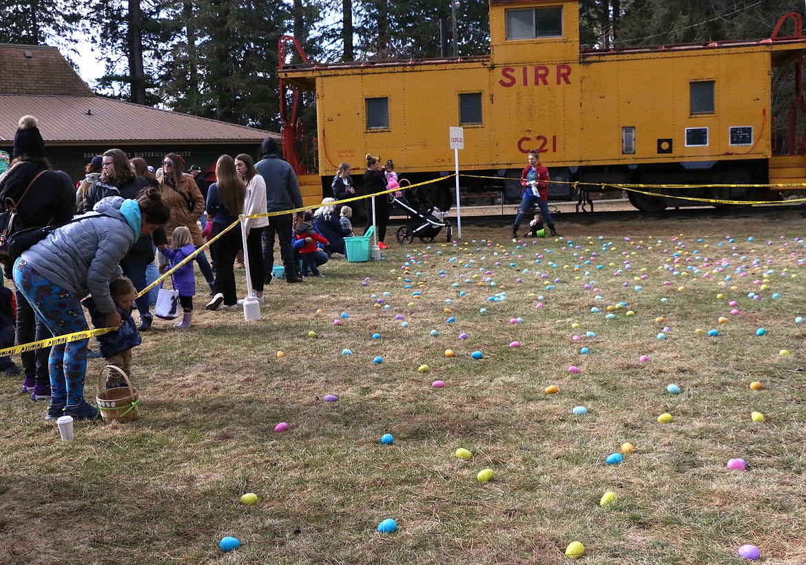 Families wait for the star of the Sandpoint Lions annual Easter egg hunt at Lakeview Park on Saturday.