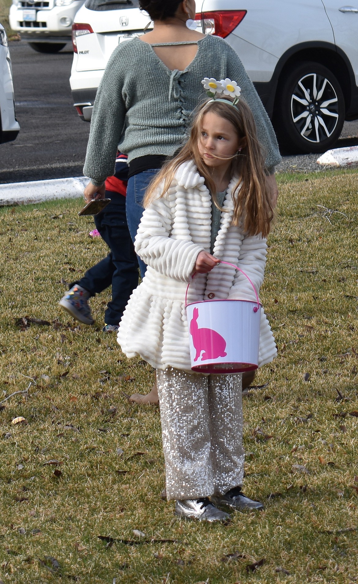 Cora Rasmussen, 6, casts around for her next egg at the George Easter egg hunt Saturday.