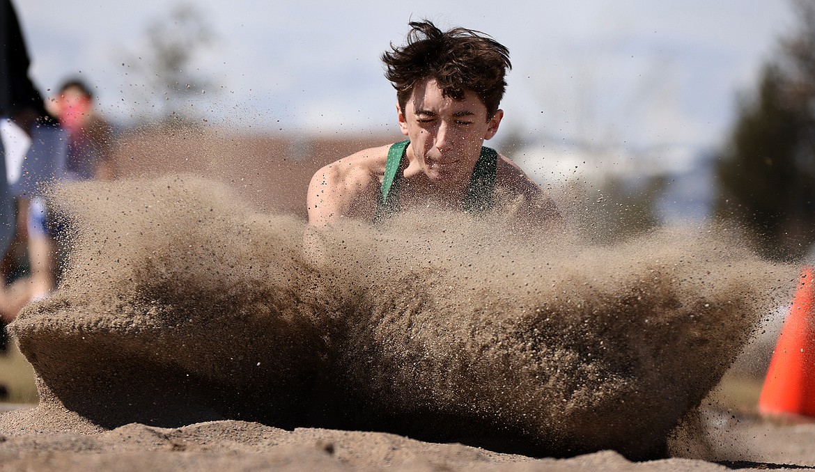 Riley Zetooney lands a long jump attempt at the Bigfork Invite on Saturday. (Jeremy Weber/Bigfork Eagle)