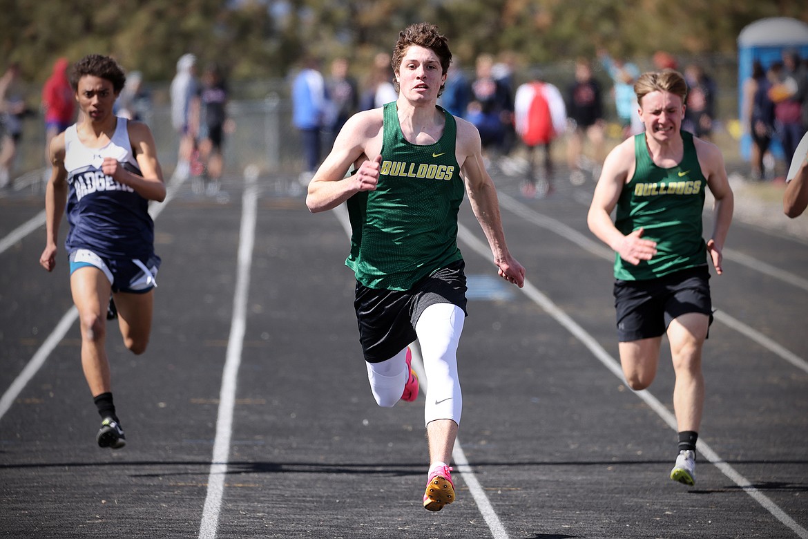 Bulldogs Morgan Kyle and Cameron Diehl run in the 100 meter dash at the Bigfork Invite on Saturday. (Jeremy Weber/Bigfork Eagle)