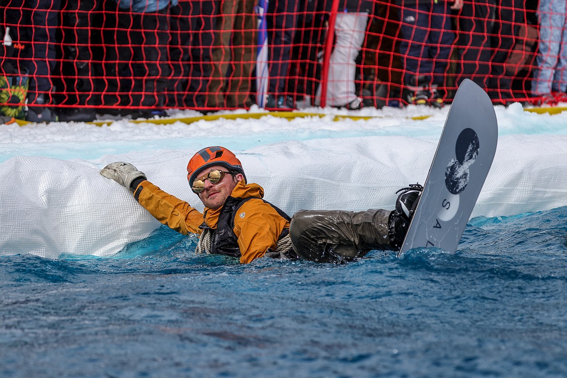 A competitor swims to shore at the Pond Skim on Saturday. (JP Edge photo)