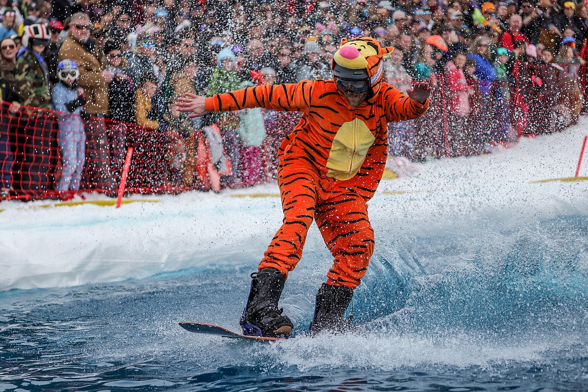 A competitor in the Pond Skim navigates across the pool on Saturday. (JP Edge photo)