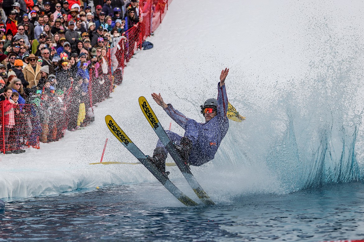 Competitors try to reach the end of the pool in the Pond Skim on Saturday. (JP Edge photo)