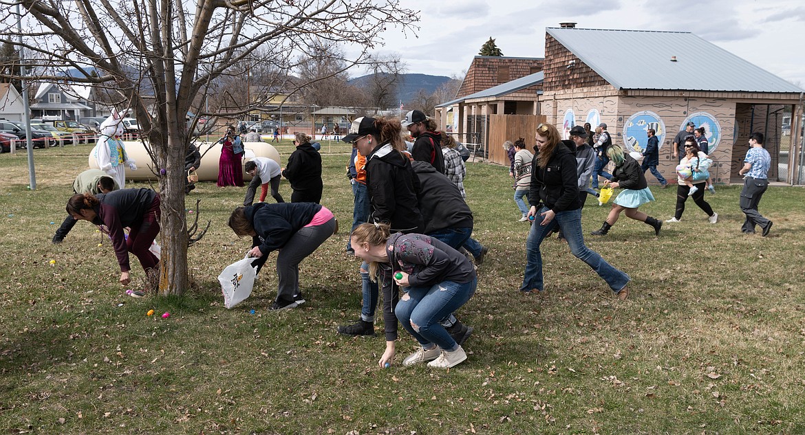 Adults storm the park at Plains in search of Easter eggs. (Tracy Scott/Valley Press)