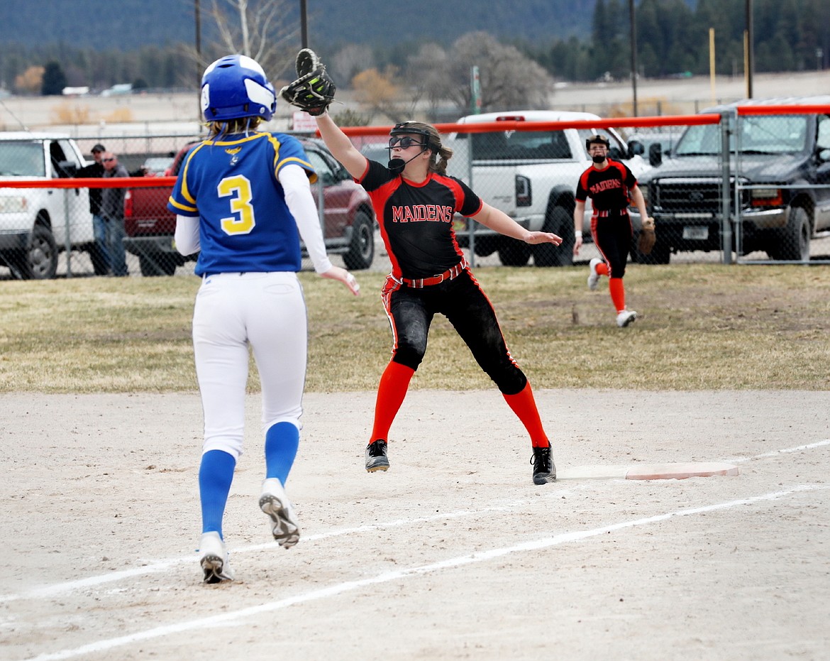 Maiden Brogan Young gets an out at first during Friday's softball game against Libby. (Susan Lake photo)