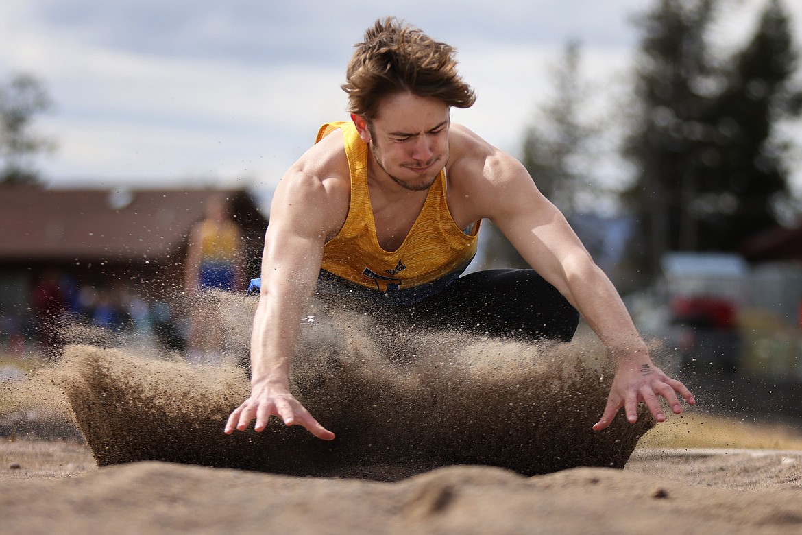 Blue Hawk Breck Ferris took third in the long jump at the Bigfork track meet Saturday with a leap of 19 feet, 3 inches. (Jeremy Weber/Bigfork Eagle)