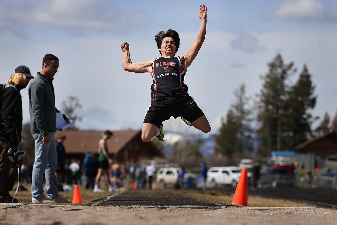 Plains' Nick Hill competes in the long jump during action at the Bigfork track meet Saturday. (Jeremy Weber/Bigfork Eagle)