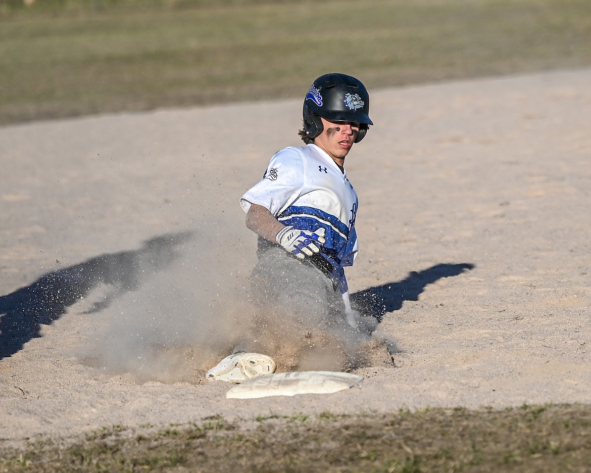 Rhain Gonzales slides into base during last Thursday's home game against Plains. (Christa Umphrey photo)