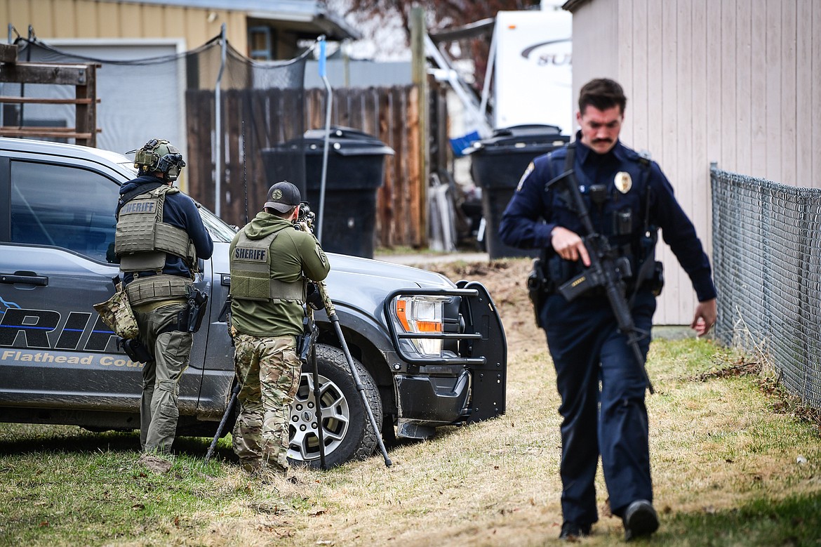 Law enforcement personnel respond to an assault with a weapon call that turned into an armed standoff between Second and Third Avenue West North in Kalispell on Tuesday, April 11. (Casey Kreider/Daily Inter Lake)