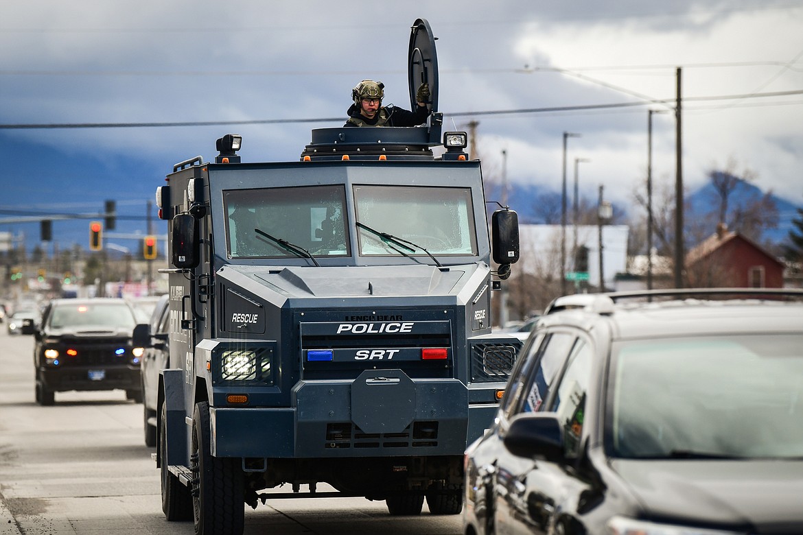 A Kalispell Police Special Response Team vehicle approaches the scene of an assault with a weapon call that turned into an armed standoff between Second and Third Avenue West North in Kalispell on Tuesday, April 11. (Casey Kreider/Daily Inter Lake)