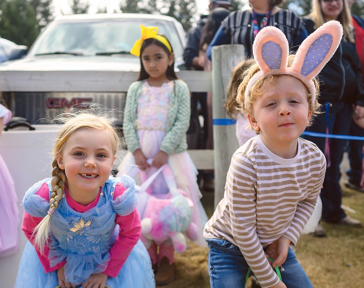 Josephine Peterson and Clark Tullos ham it up for the camera during the Lions Club Easter egg hunt Sunday.