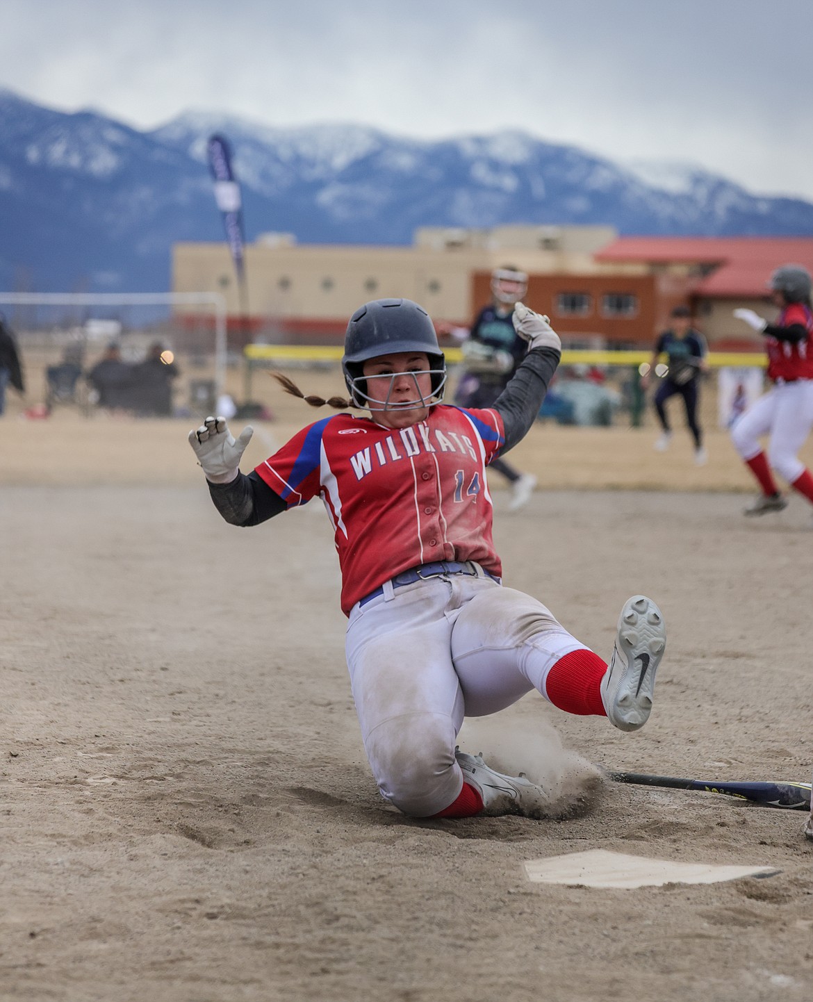 Sophie Robbins slides into home plate at Glacier High School on Friday. (JP Edge photo)