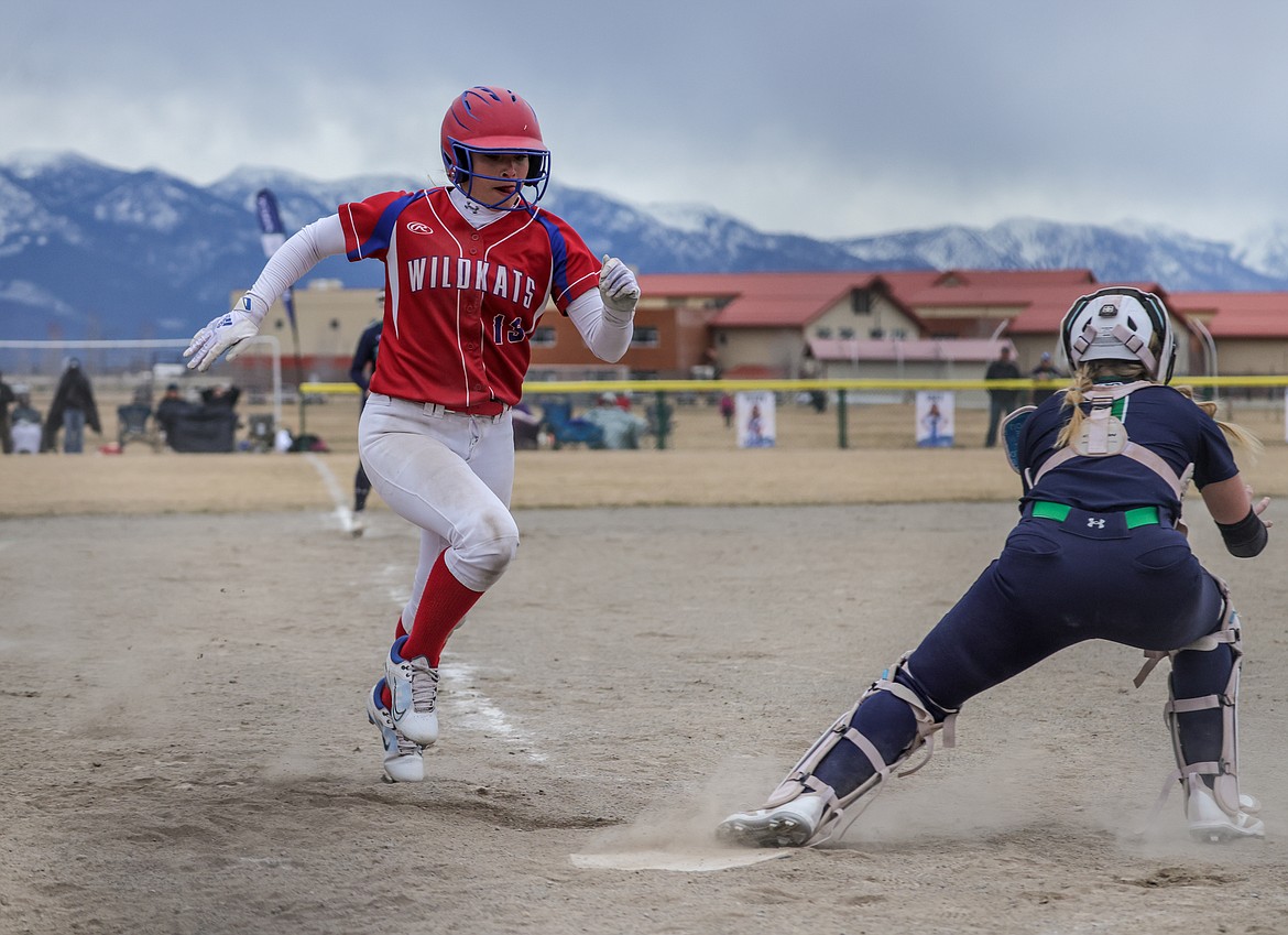 Senior Sydney Mann runs scores on Friday at Glacier High School. (JP Edge photo)