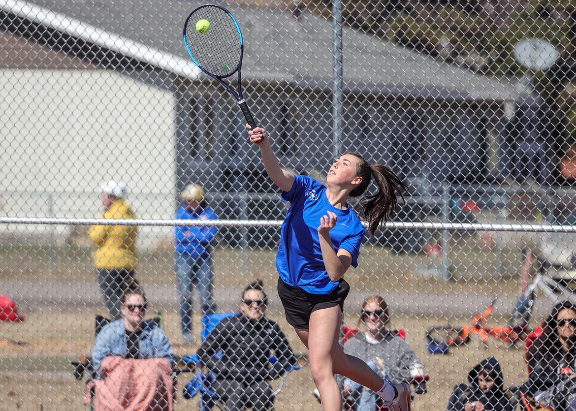 Senior Cloey Ramage serves against Whitefish on Thursday at home. (JP Edge photo)