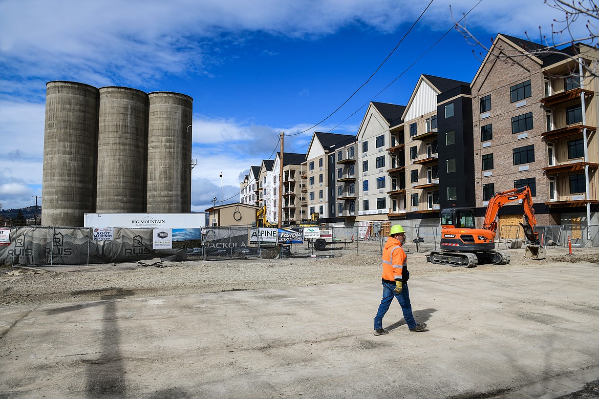 Construction continues at Flathead Valley developer Mick Ruis' 'The Silos' project at the former CHS grain elevator site at Fifth Avenue West and West Center Street in Kalispell on Tuesday, April 11. (Casey Kreider/Daily Inter Lake)