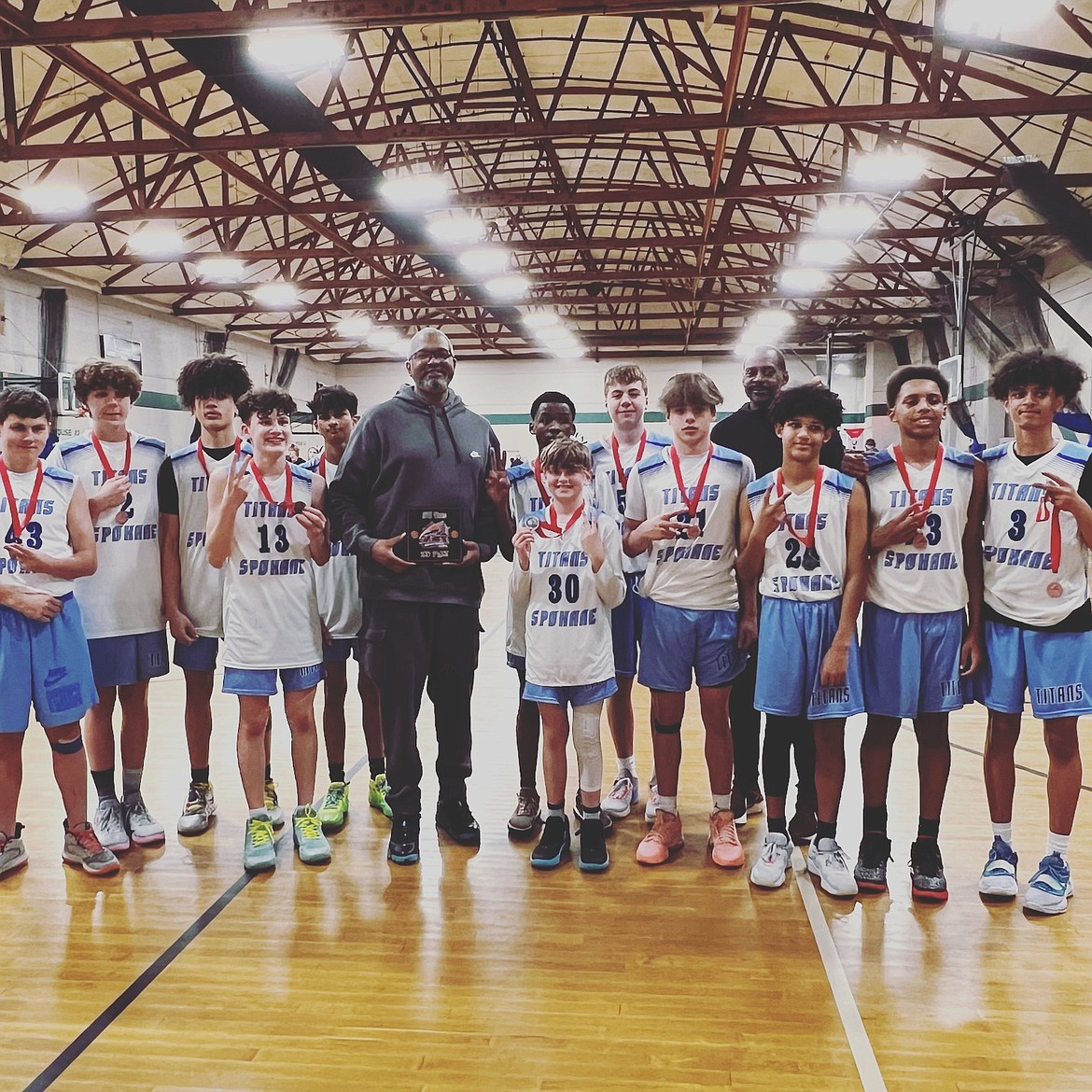 Courtesy photo
The eighth grade Spokane Titans boys AAU basketball team took second place in the 15U (9th grade) division at the Stars Shootout on April 8 at The Warehouse in Spokane. From left are Easton Buie, Andrew Krustangel, Tyson Vogrig, Wallace Frates, Vihaan Rajeev, coach Leon Sayers, Buga Kasomo, Sawyer Norisada, Henry Hard, Makya Quincy, coach Darryl Spencer, Ja'Kolbe Lopp, Miles Spencer and Jamir Johnson. Norisada and Quincy are from Post Falls.