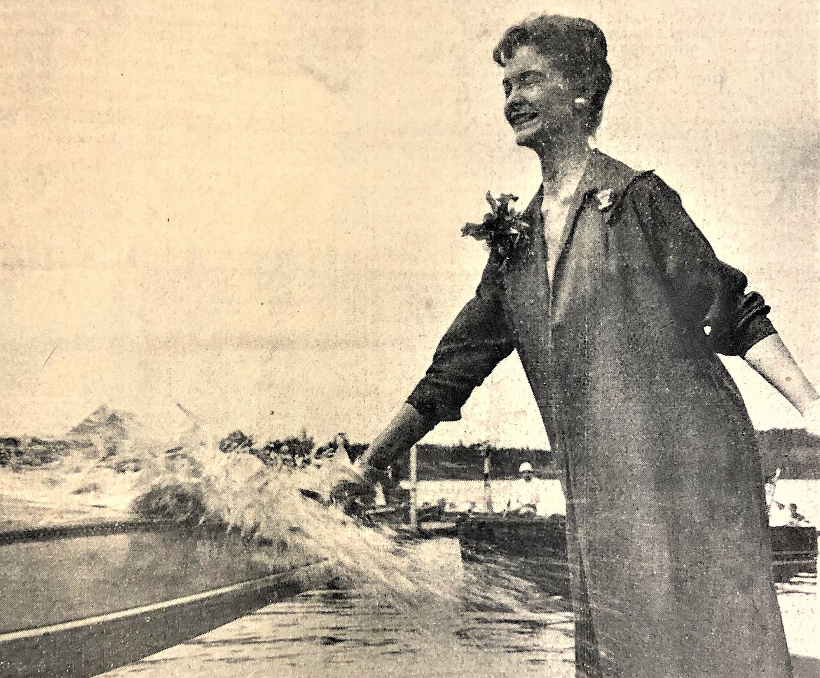 Miss Washington Anne Henderson christens hydroplane Miss Spokane at Hayden Lake.