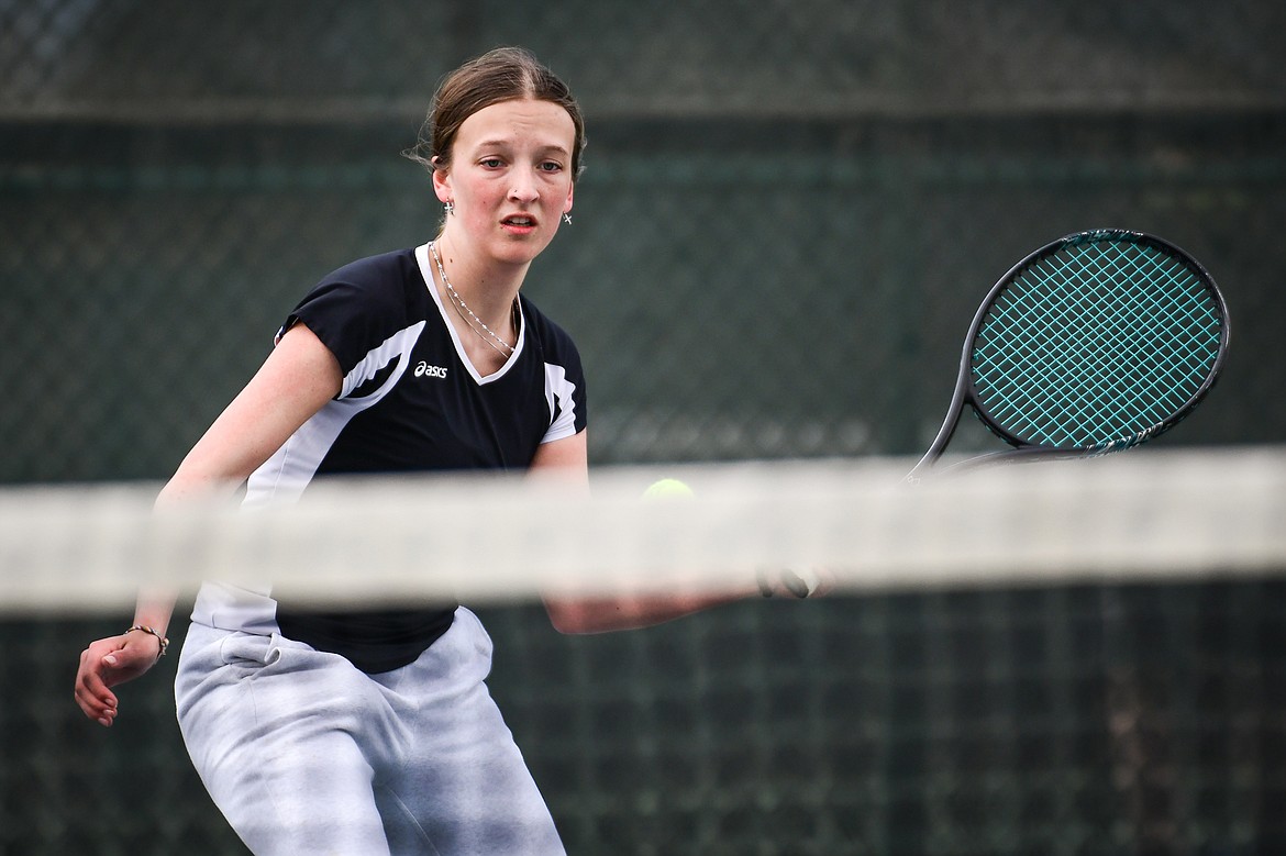 Flathead's Alexis Kersten hits a return in a girls singles match against Glacier's Naomi Jutzi at Flathead Valley Community College on Thursday, April 13. (Casey Kreider/Daily Inter Lake)