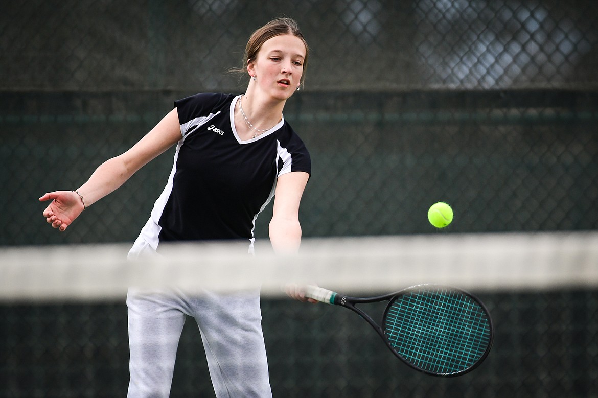 Flathead's Alexis Kersten hits a return in a girls singles match against Glacier's Naomi Jutzi at Flathead Valley Community College on Thursday, April 13. (Casey Kreider/Daily Inter Lake)