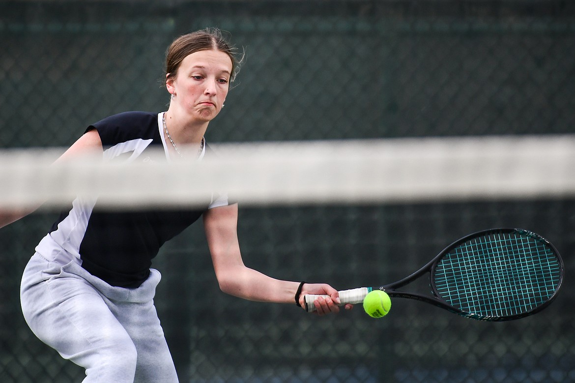 Flathead's Alexis Kersten hits a return in a girls singles match against Glacier's Naomi Jutzi at Flathead Valley Community College on Thursday, April 13. (Casey Kreider/Daily Inter Lake)