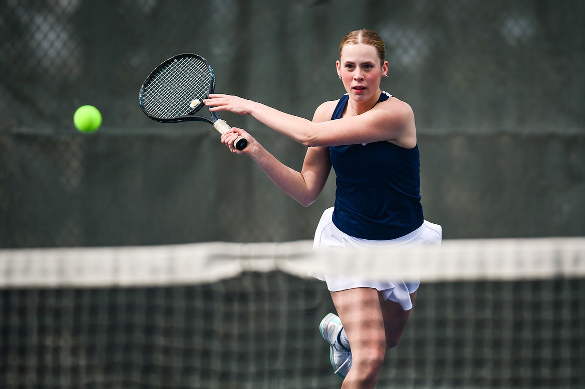 Glacier's Sarah Downs hits a return in a girls doubles match with partner Haven Speer against Flathead's Patricia Hinchey and Clara Jones at Flathead Valley Community College on Thursday, April 13. (Casey Kreider/Daily Inter Lake)