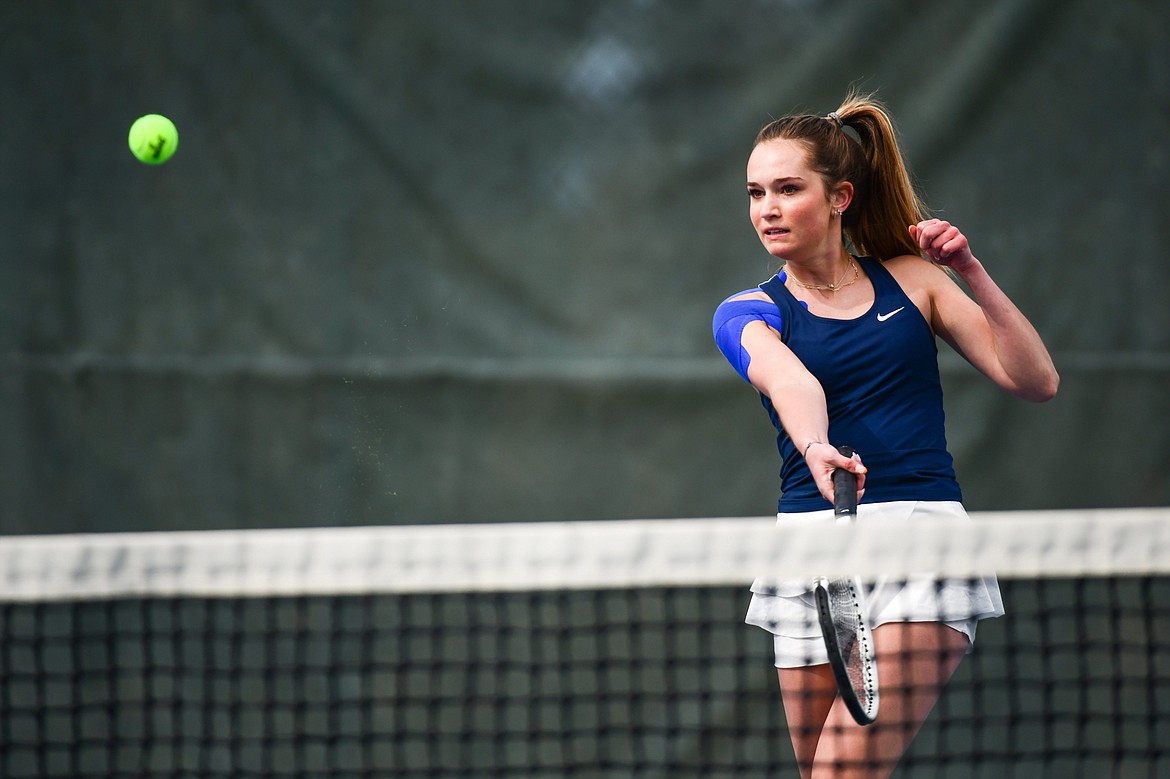 Glacier's Haven Speer hits a return in a girls doubles match with partner Sarah Downs against Flathead's Patricia Hinchey and Clara Jones at Flathead Valley Community College on Thursday, April 13. (Casey Kreider/Daily Inter Lake)