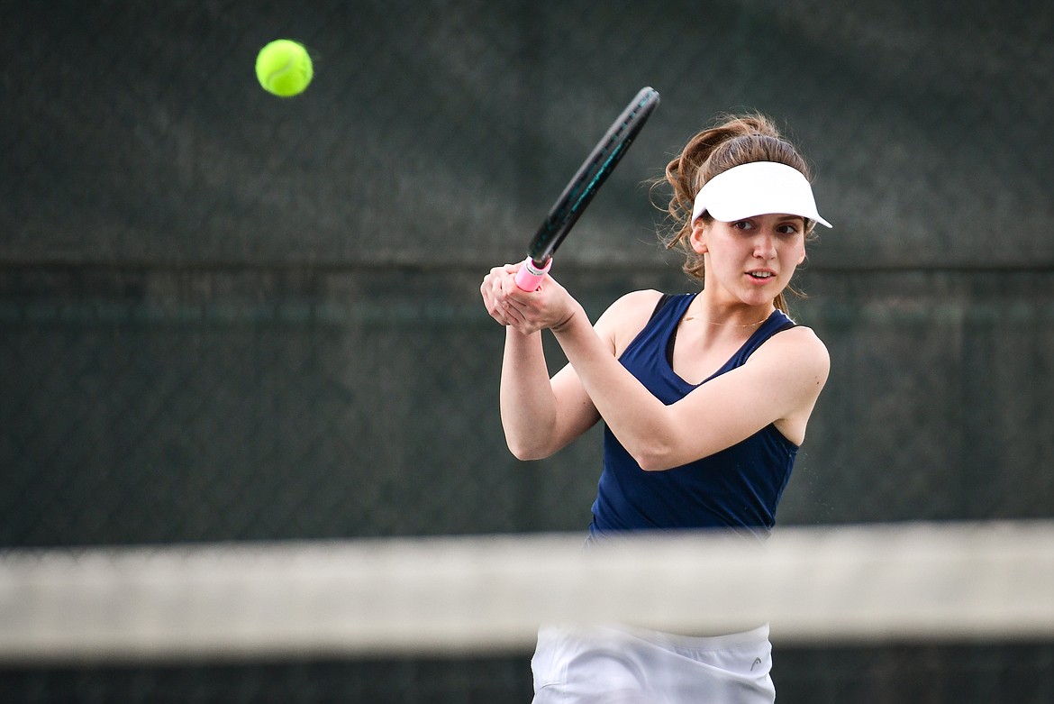 Glacier's Naomi Jutzi hits a return in a girls singles match against Flathead's Alexis Kersten at Flathead Valley Community College on Thursday, April 13. (Casey Kreider/Daily Inter Lake)