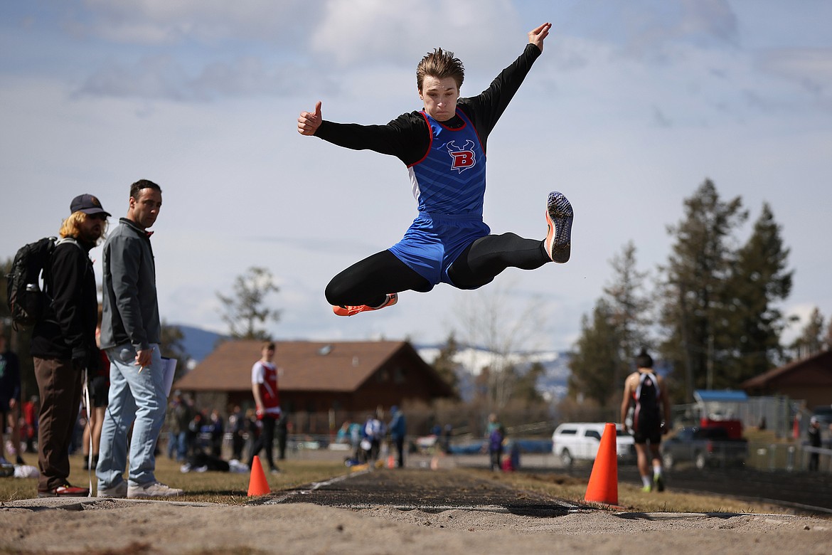 Levi Peterson leaps his way to a first-place finish in the long jump Saturday. (Jeremy Weber/Bigfork Eagle)