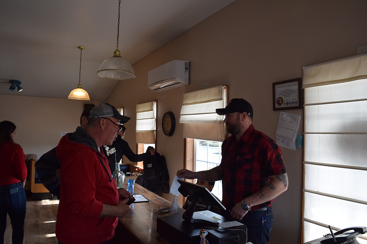 A staff member cashes out customers after a meal at Country Deli. New owners, Jeovani Dircio and his sister Gabriela Dircio, said they’ll be keeping the same staff and breakfast/lunch menu, but refreshing a few things here and there to make the business more inviting and comfortable for diners.