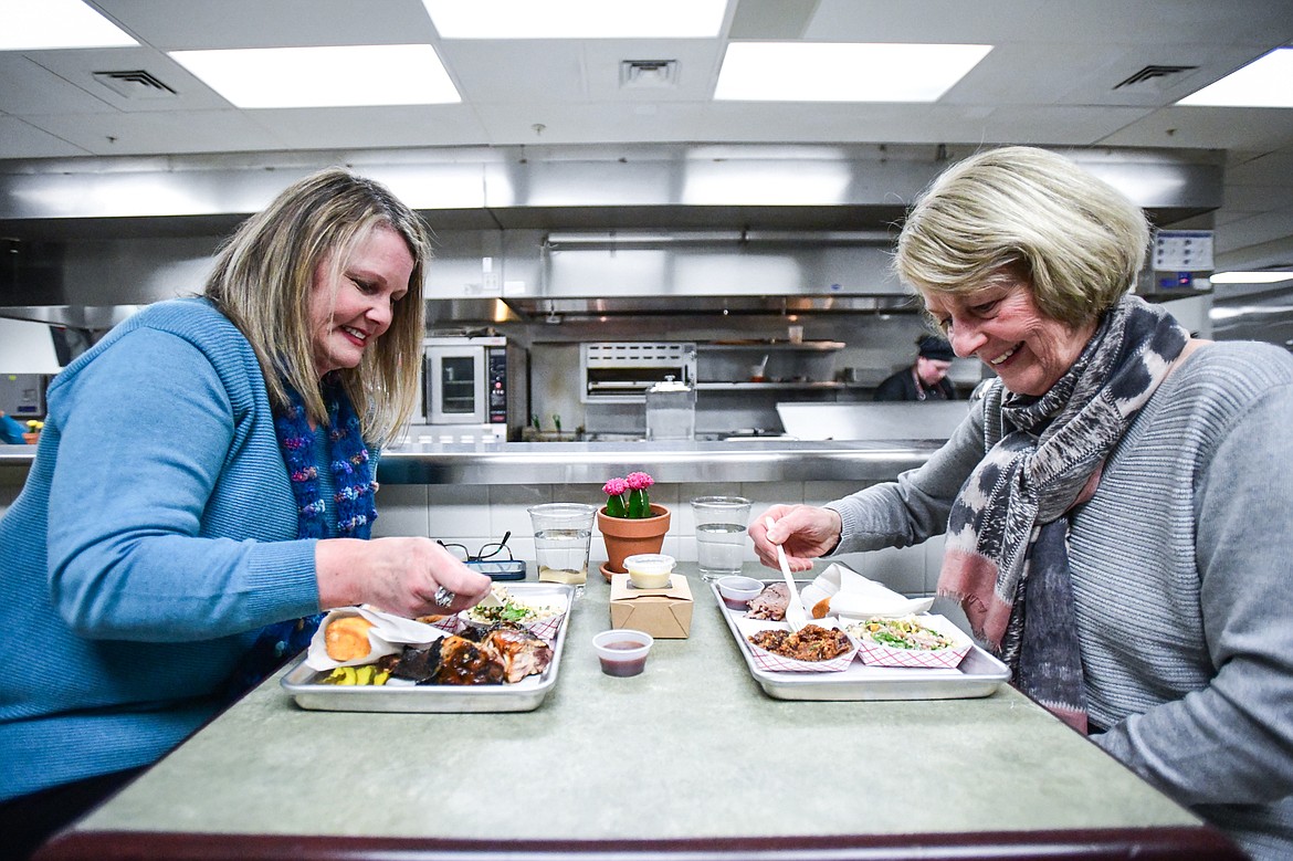 Michelle Williamson, left, and Karen Panissidi enjoy their meal at Flathead Valley Community College's pop-up lunch restaurant "Smolder," operated by students in the school's Culinary Institute of Montana on Thursday, April 13. (Casey Kreider/Daily Inter Lake)