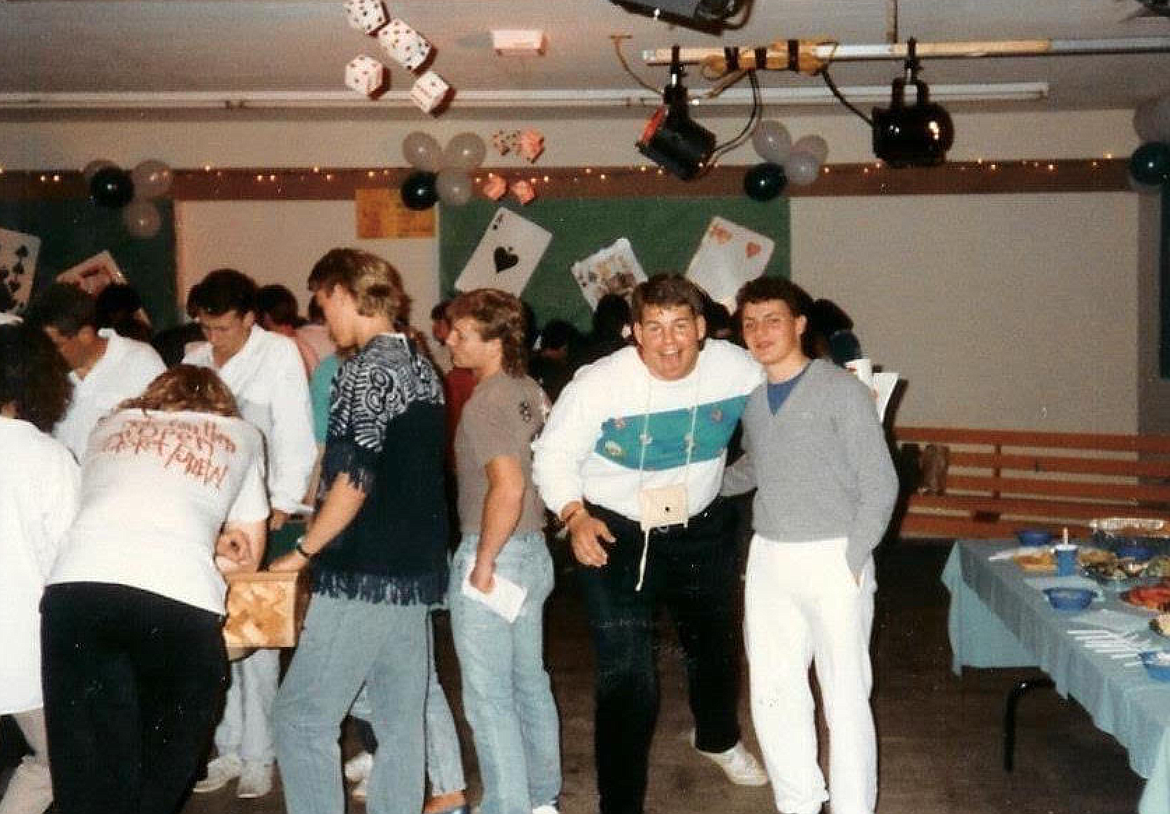 Rick Grunden, in the white and teal, sticks out his tongue at the camera during the 1988 Coeur d'Alene High grad night.