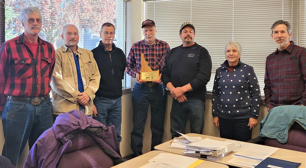 Associate Supervisor Bob Flagor was recently honored with a plaque for 22 years of service to the Kootenai-Shoshone Soil &amp; Water Conservation District. From left, John Mobbs and Jon Groth, associate supervisors; Wes Evans, supervisor/treasurer; Flagor; Laurin Scarcello, chairman; Linda Ely, vice chairman; and Thomas Shaffer, supervisor. Flagor worked as a diesel mechanic for over 20 years before returning to school to earn his degree in environmental science at the University of Idaho. He has worked for the conservation district since 2001.