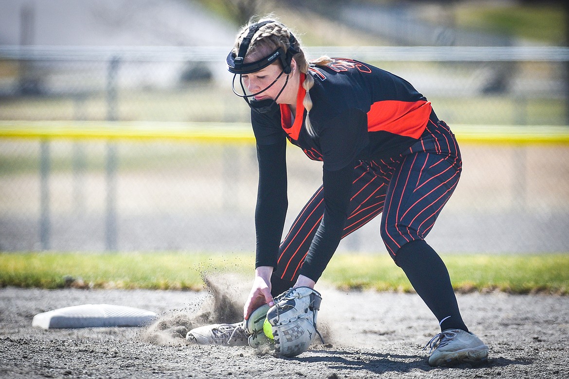 Flathead second baseman Brynn Mailman (30) fields a ground ball for an out at first against Helena at Kidsports Complex on Saturday, April 15. (Casey Kreider/Daily Inter Lake)