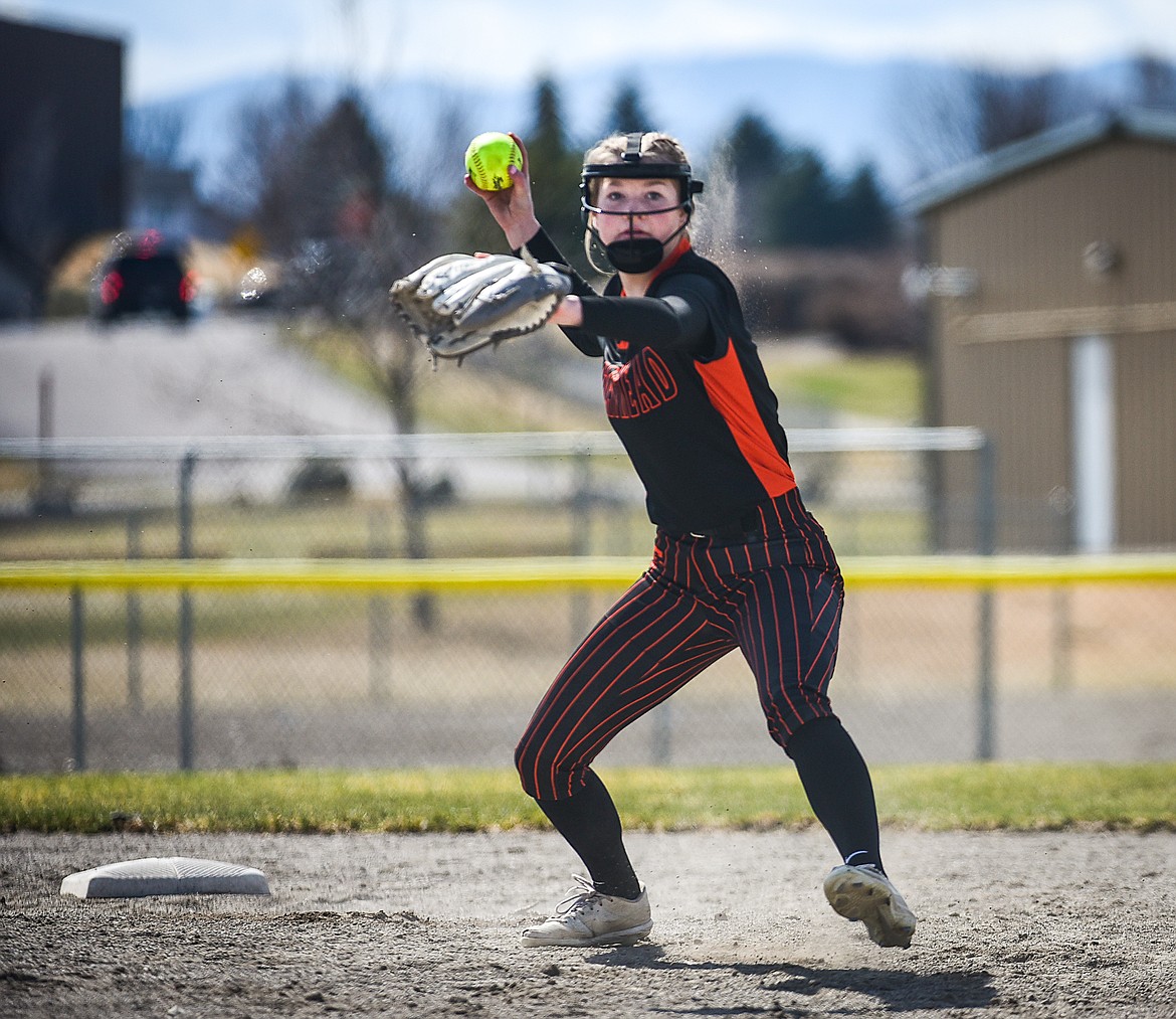 Flathead second baseman Brynn Mailman (30) throws to first base for an out against Helena at Kidsports Complex on Saturday, April 15. (Casey Kreider/Daily Inter Lake)