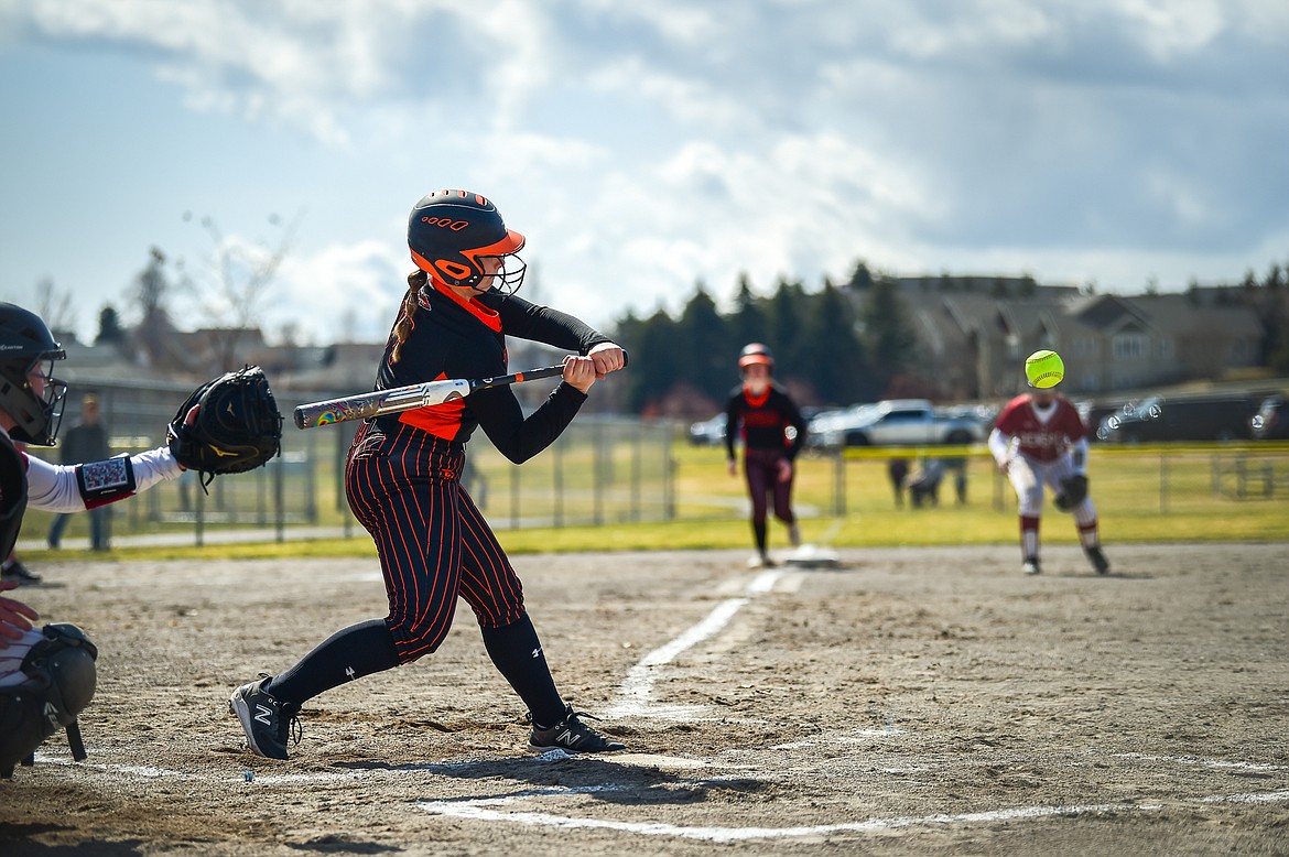 Flathead's Reese Conley (17) connects on a two-run home run to right field in the first inning against Helena at Kidsports Complex on Saturday, April 15. (Casey Kreider/Daily Inter Lake)