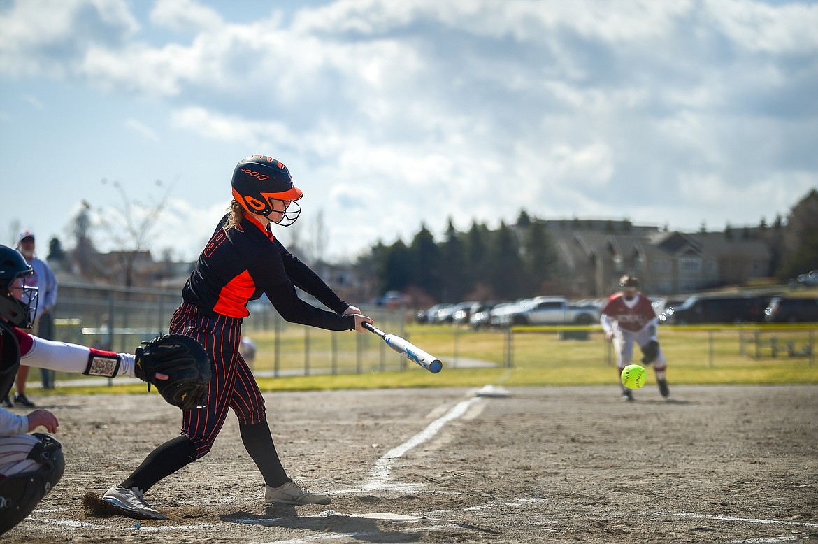 Flathead's MacKenzie Brandt (8) connects on a triple into right field in the first inning against Helena at Kidsports Complex on Saturday, April 15. (Casey Kreider/Daily Inter Lake)