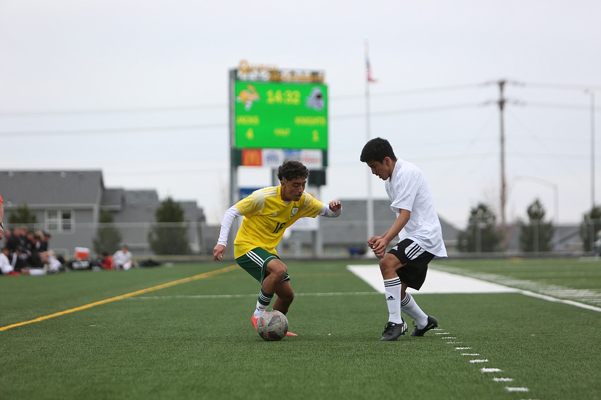 Quincy junior Alexander Murillo, left, works against Royal senior Oscar Cervantes, right, in the second half in Saturday’s 6-1 win over the Knights.