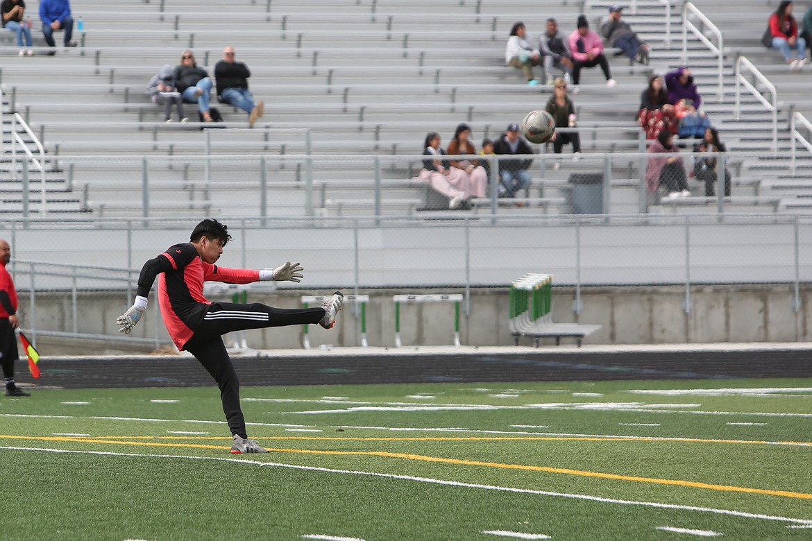 Royal senior goalkeeper punts the ball deep in the first half against Quincy on Saturday.