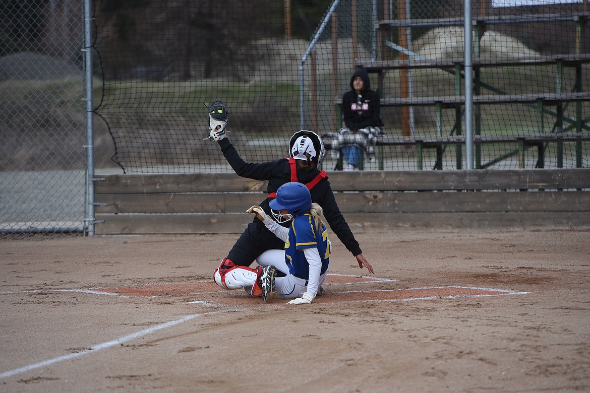 Libby's Mackenzie Foss slides into home to score a run Friday, April 14 against Browning. The Lady Loggers swept a doubleheader in convincing fashion. (Scott Shindledecker/The Western News)