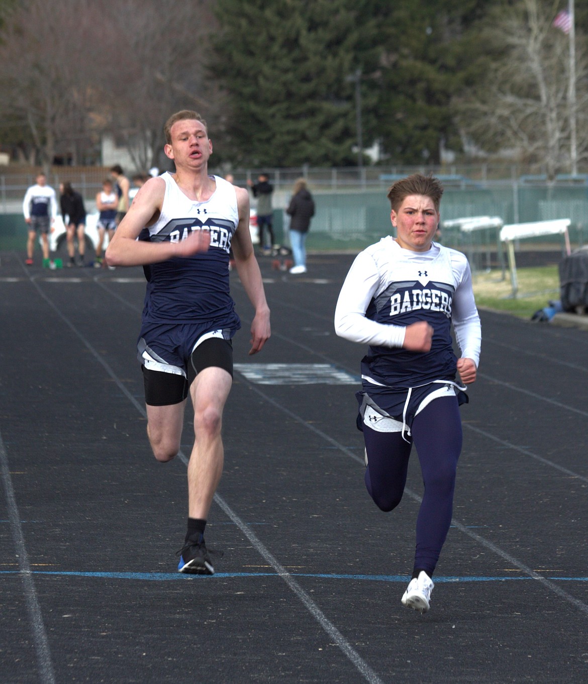 Badger boys sprinters compete in the 100m on April 13.