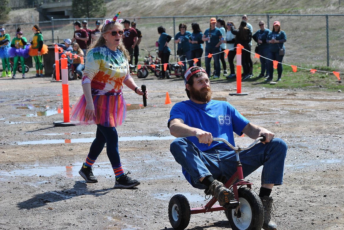 Bartender, race coordinator and announcer, Debby Norris spent the day Saturday getting teams to the starting line and encouraging them to try their best to make it to the finish line. (Amy Quinlivan/Mineral Independent)