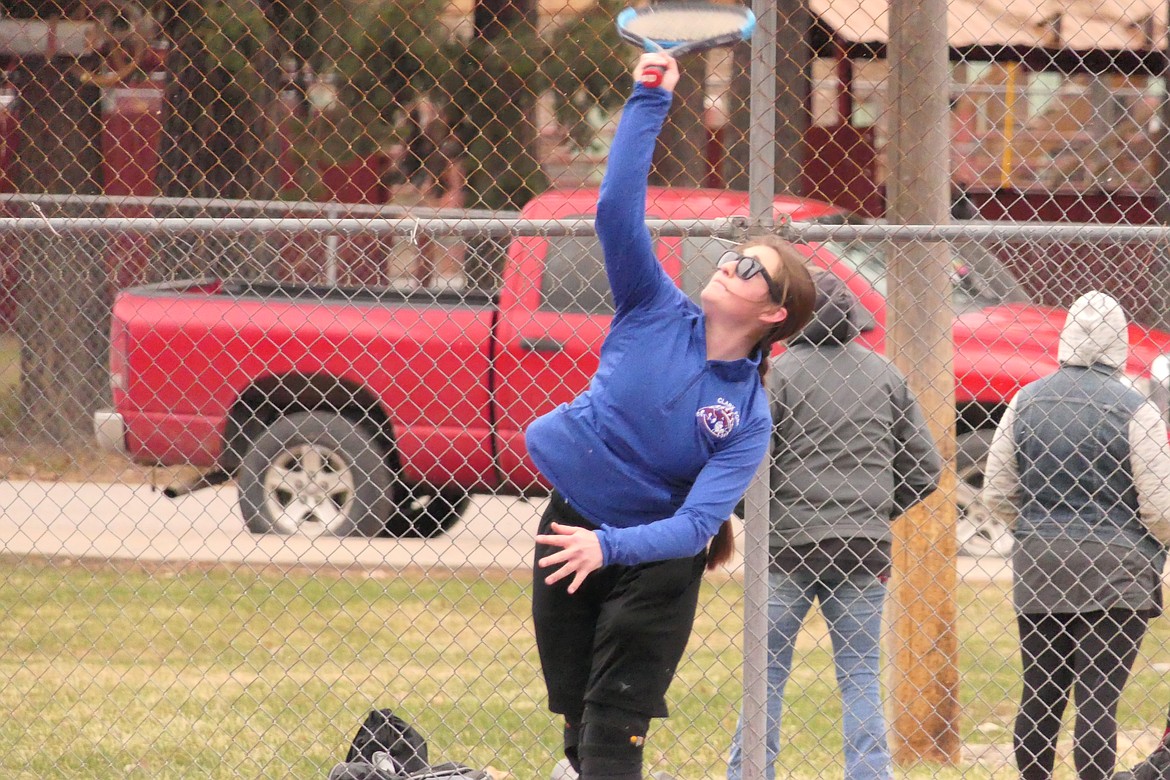 Superior junior Lanie Crabb returns a high shot during her singles match against Mission's Lanie Keast this past Friday in Superior. (Chuck Bandel/VP-MI)