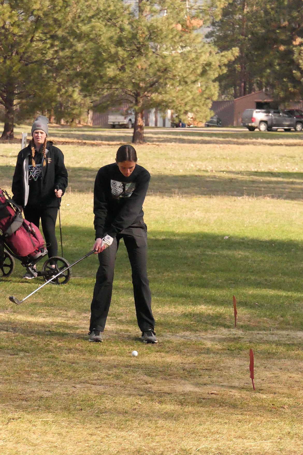 Thompson Falls golfer Ellie Baxter, who fired an 18-hole total 88, tees off on the second hole at Wild Horse Prairie Golf Course during Friday's Plains Invitational which attracted 75 area high school golfers.  (Chuck Bandel/VP-MI)