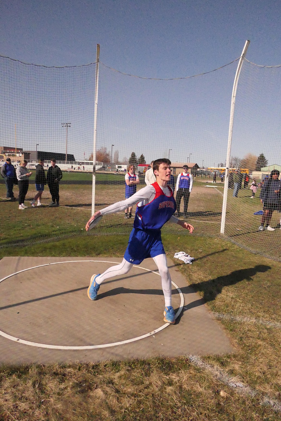 Superior eighth grader Landon Richards spins and throws the discus during Saturday's Dilly Bar Invitational track and field meet in Ronan.  (Chuck Bandel/MI-VP)