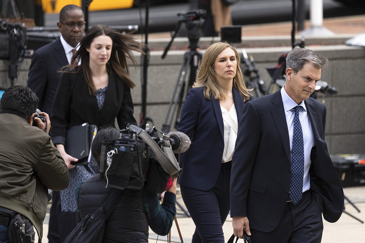 Representatives of Fox News arrive at the justice center in Wilmington, Del., for the Dominion Voting Systems' defamation lawsuit against Fox News, Tuesday, April 18, 2023. (AP Photo/Matt Rourke)