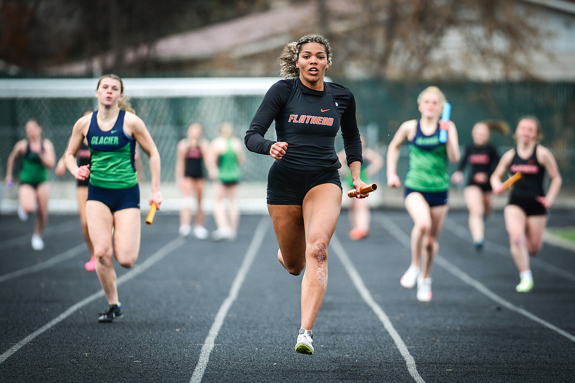 Flathead's Akilah Kubi runs the anchor leg of the 4 x 100 relay during a crosstown track meet with Glacier at Legends Stadium on Tuesday, April 18. (Casey Kreider/Daily Inter Lake)