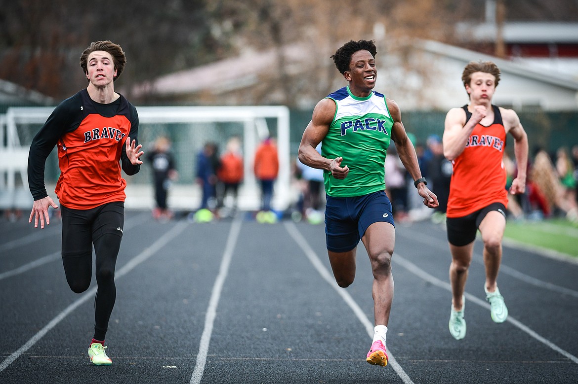 Glacier's Jeff Lillard places first in the 100 meter dash during a crosstown track meet with Flathead at Legends Stadium on Tuesday, April 18. (Casey Kreider/Daily Inter Lake)
