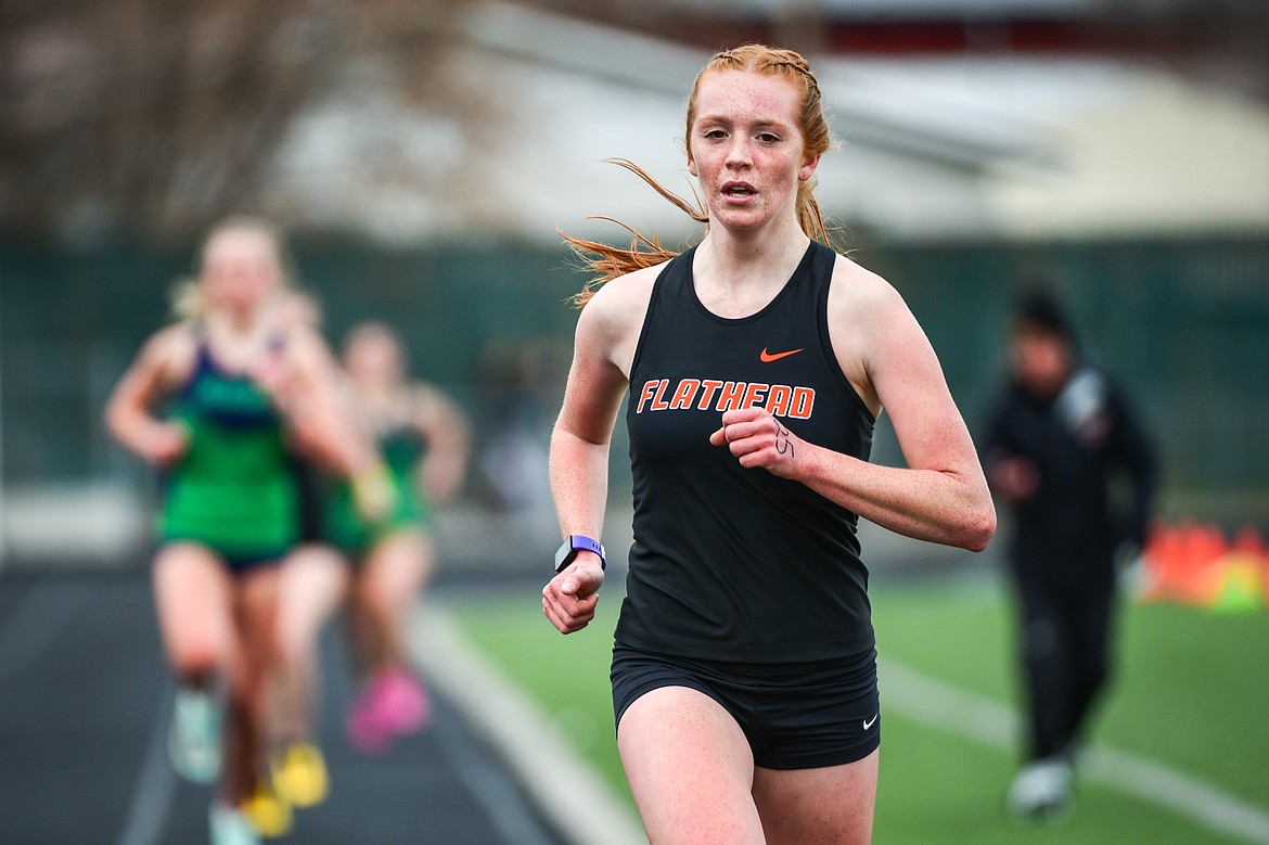 Flathead's Madelaine Jellison leads the 1600 meter run during a crosstown track meet with Glacier at Legends Stadium on Tuesday, April 18. (Casey Kreider/Daily Inter Lake)