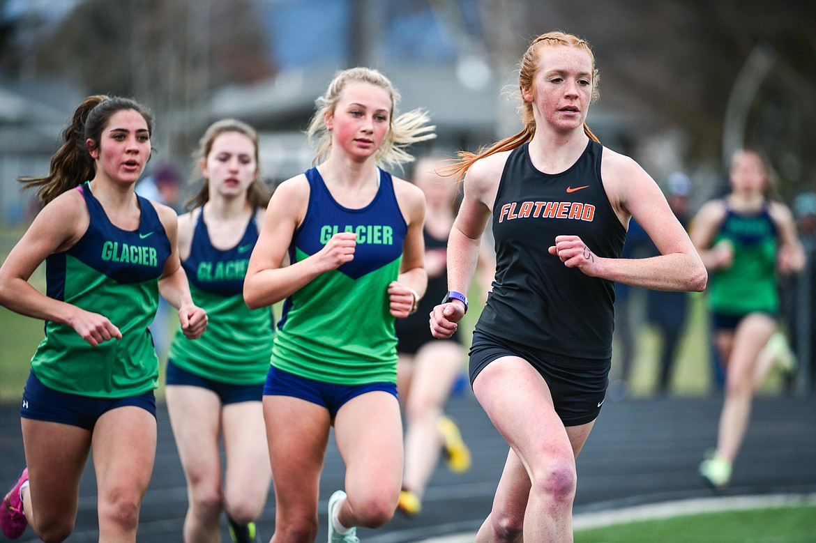 Flathead's Madelaine Jellison leads the 1600 meter run during a crosstown track meet with Glacier at Legends Stadium on Tuesday, April 18. (Casey Kreider/Daily Inter Lake)