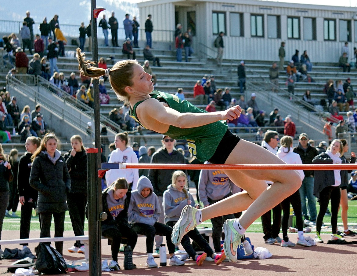 Whitefish junior Hailey Ells clears 5 feet in the high jump at the meet in Missoula on Saturday. (Matt Weller photo)